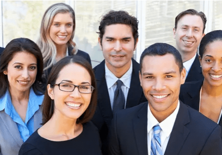 Diverse business team smiling confidently.